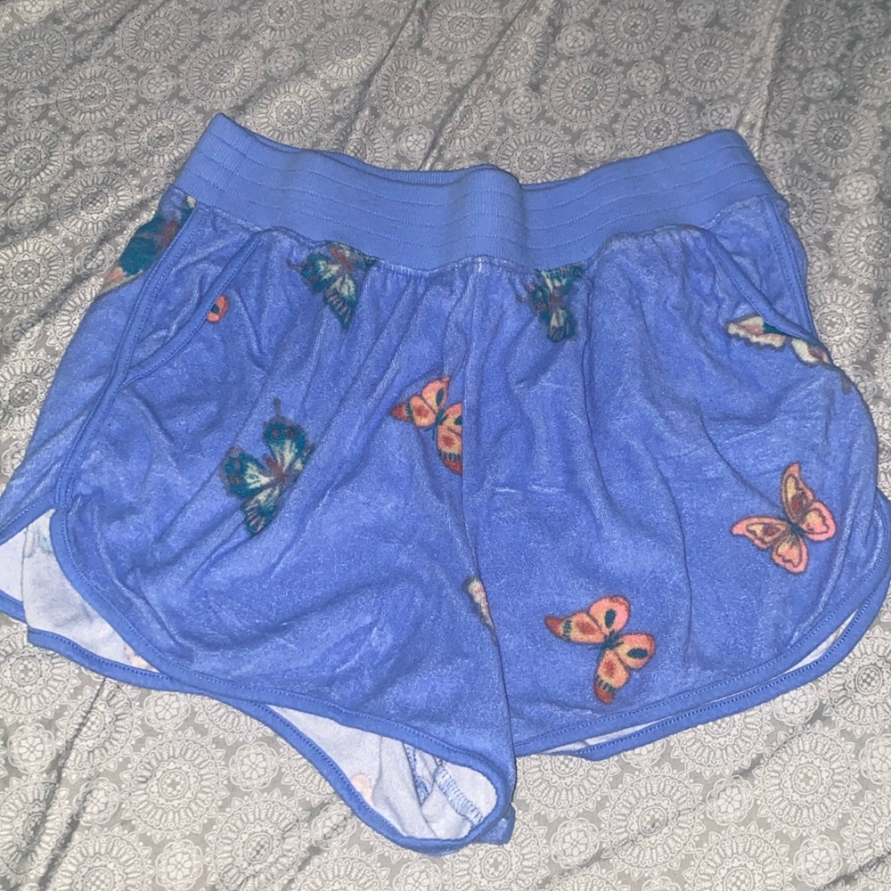 Never worn, butterfly shorts.
